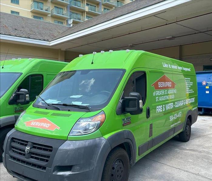 servpro vehicles outside a world golf village hotel responding to water damage