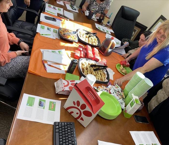 A table with chick fil a breakfast at a lunch and learn for local property managers