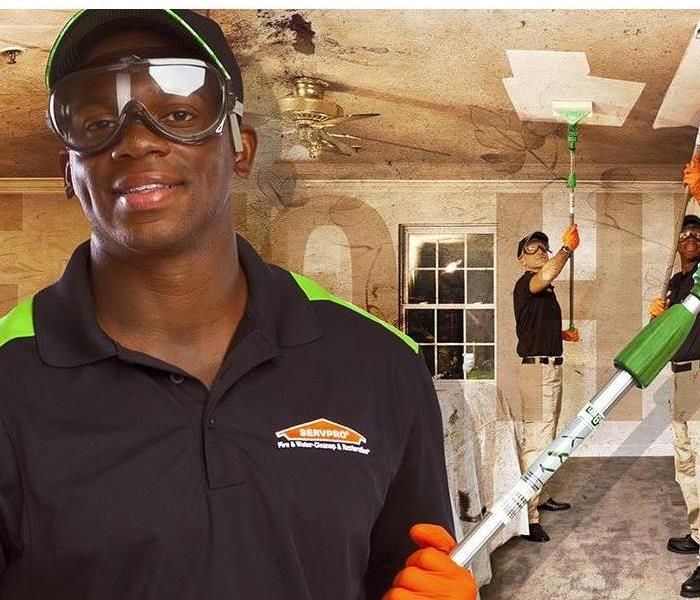 Our team of SERVPRO Professionals removing soot from walls and ceilings.